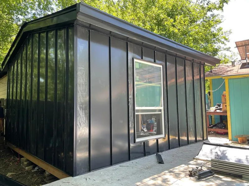 Black standing seam metal wall panels for Roof Inspection in Manistee