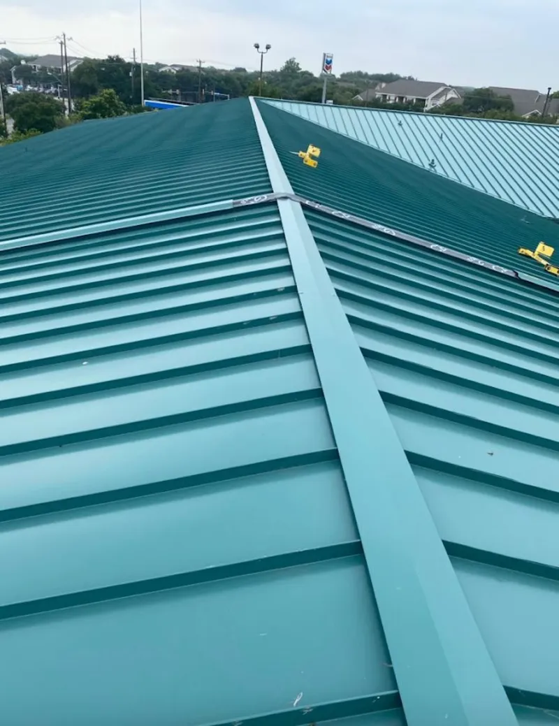 Green commercial metal roof ridge and valley for Metal Roof Repair in Manistee