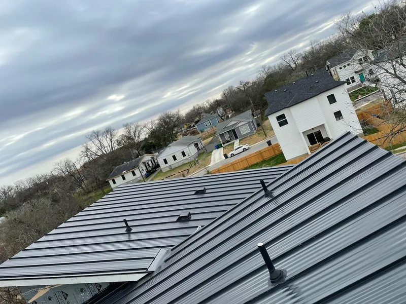 Standing seam metal roof panels with vents for Skylight Repair in Manistee